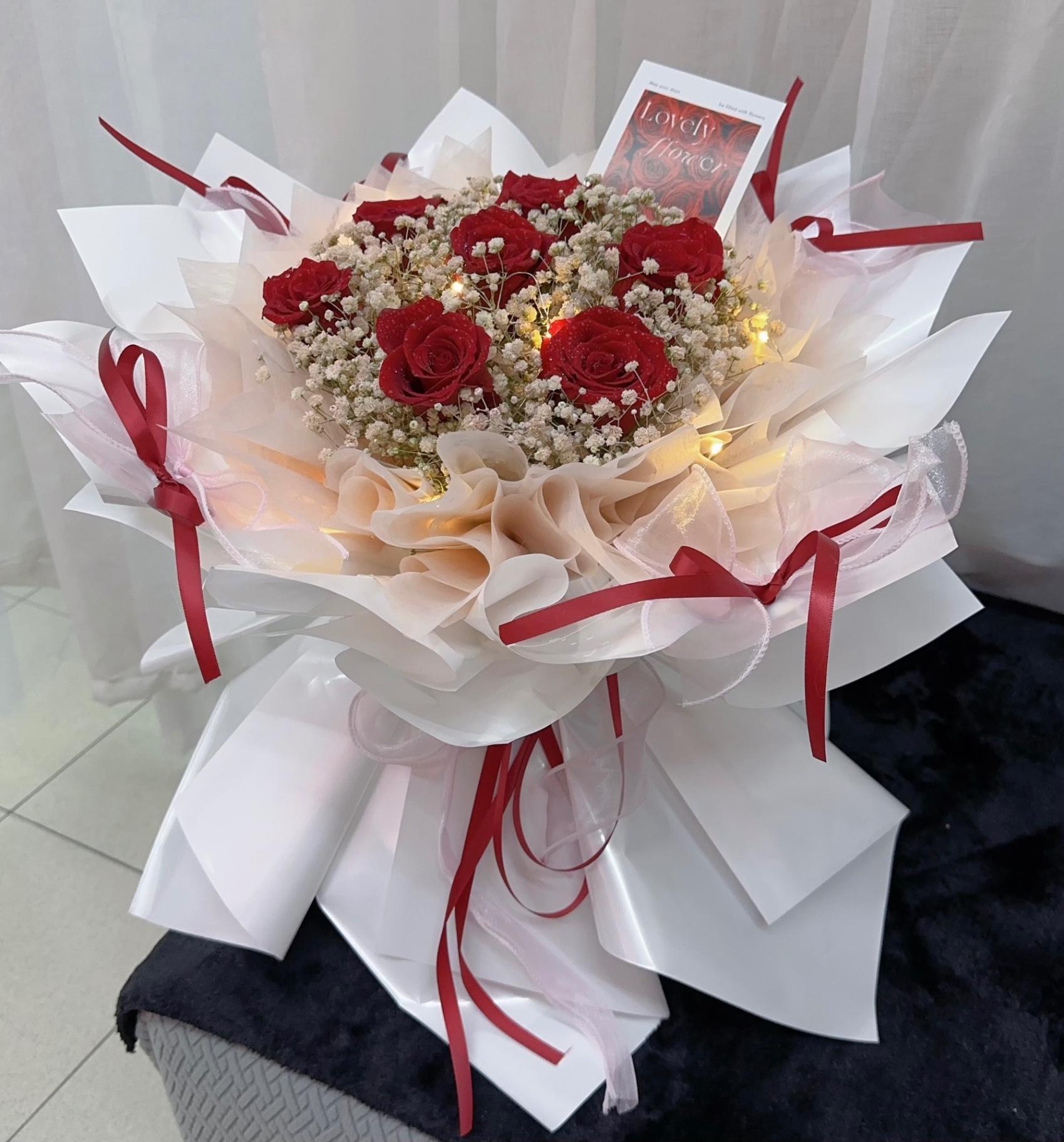 7 stalks red roses + baby breath hand bouquet. Fresh flower